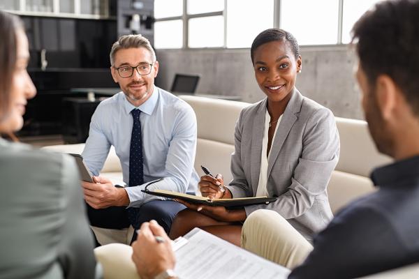 Four people sat in an office